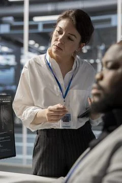 Data center engineering team using PC to update servers tech Stock Photos