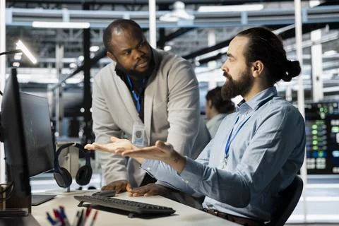 Data center engineering team working together to verify parameters Stock Photos