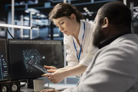 Data center engineers collaborate, doing brainstorming, analyzing software logs Stock Photos