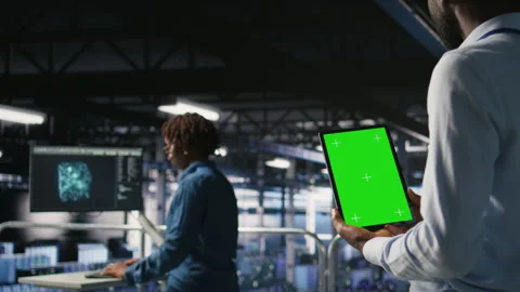 Data center engineers on industrial platform using isolated screen device Stock Footage 310781276