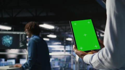 Data center engineers on industrial platform using isolated screen device 스톡 사진