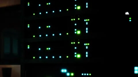 Data center equipment with glowing indicators and lights at night Stock Footage 344998603