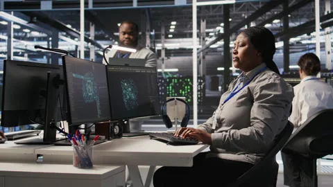 Data center expert doing software updates, verifying machine learning parameters Stock Footage 309366540