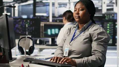 Data center expert doing software updates, verifying machine learning parameters Stock Footage 309627927