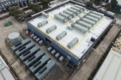 Data center facility with rooftop cooling units in aerial view Stock Photos