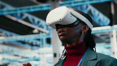 Data center female engineer putting VR glasses on to do gear rigs optimization Video stock 329651277