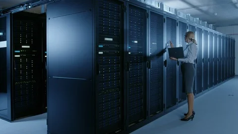 In Data Center: Female IT Technician Running Maintenance Programme on a Laptop Stock Footage 101174328