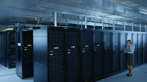 In Data Center: Female IT Technician Running Maintenance Programme on a Laptop Stock Footage 101175404