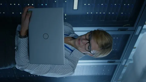 In Data Center: Female IT Technician Running Maintenance Programme on a Laptop Stock Footage 118264897