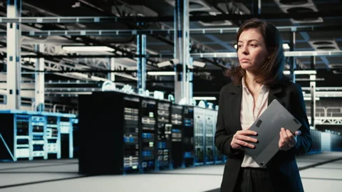 Data center female programmer creating digital twin scan to optimize servers Stock-Footage 329330240