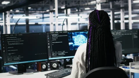 Data center female programmer uses machine learning algorithms to analyze Stock-Footage 313566729