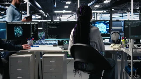 Data center female programmer uses machine learning algorithms to analyze Stock Footage 313640215