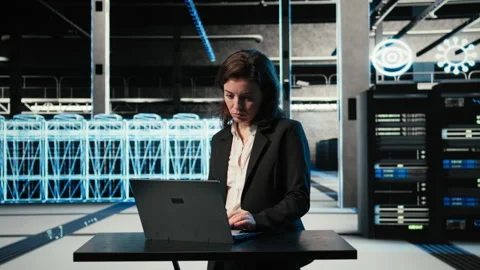 Data center female programmer uses laptop and AR virtualization Stock Footage 329326548