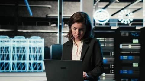 Data center female programmer uses laptop and AR virtualization Stock Footage 329326602