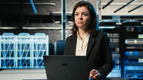 Data center female programmer uses laptop and AR virtualization Stock-Fotos