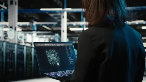 Data center female programmer using AI LLM model on laptop Stock Footage 330099037