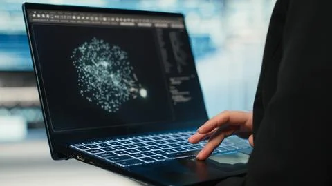Data center female programmer using AI LLM model on laptop Stock-Fotos