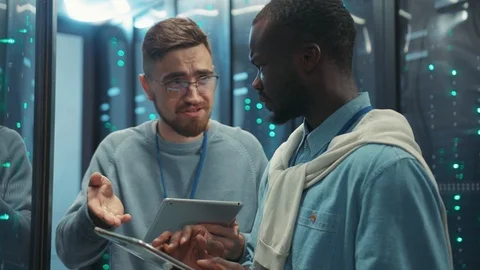 In data center head administrator arguing with young black technician Video stock 119784475