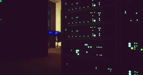 Data center illuminated by server lights during evening hours Stock Illustration