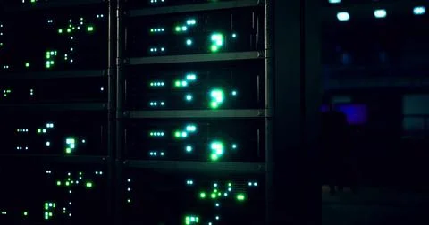 Data center with illuminated server racks operating at night 스톡 일러스트