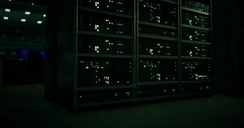 Data center with illuminated servers in dark environment at night Stock Illustration