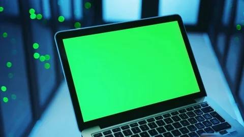 Data center IT administrator using laptop in work, programming code on green Stock Footage 121116789