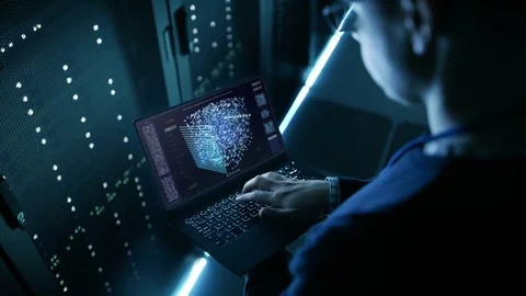 Data Center IT Engineer Holds Laptop and Works on the Neural Network AI Project. Stock Footage