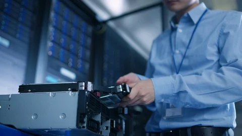 In the Data Center: IT Engineer Installs New HDD Hard Drive and Other Hardware Stock Footage 101183537