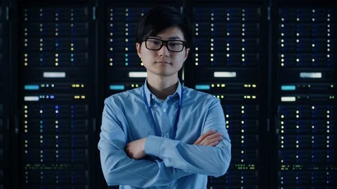 Data Center: IT Engineer Wearing Protective Headphones Install New Hardware Stock Footage 101182727