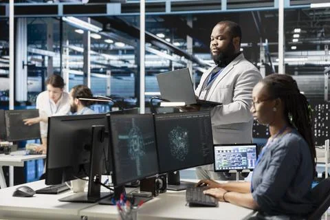 Data center IT experts using artificial intelligence neural networks technology Stock Photos