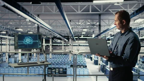 Data center IT professional deploys deep learning software on racks Stock Footage 314804340