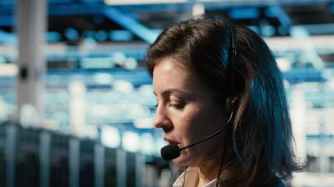 Data center IT support worker diagnosing issues using AR holographic Stock Footage 329330382