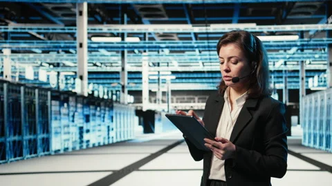 Data center IT support worker diagnosing issues using AR holographic Stock Footage 330100116