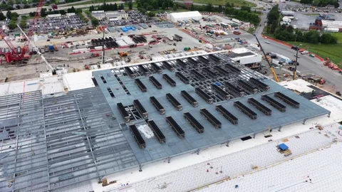 Data center in Lancaster shows partially installed rooftop cooling arrays on Stock Footage 337969060
