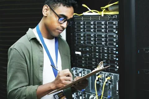 Data center, man and computer engineer with checklist, writing and notes as Foto stock