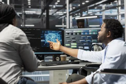 Data center manager and engineer with paraplegia using artificial intelligence Stock Photos