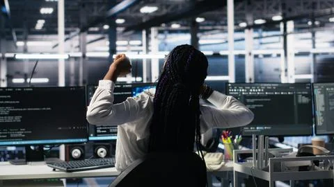 Data center manager checking work done by admins using deep learning Foto stock