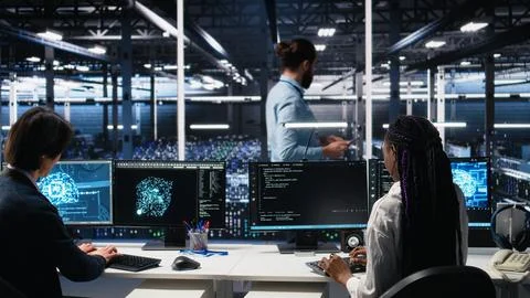 Data center manager checking work done by admins using deep learning Foto stock