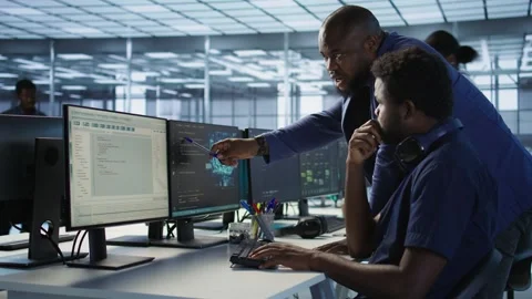 Data center manager helps intern implement AI predictive systems Stock Footage 319564542