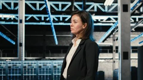 Data center manager inspecting equipment rigs, VFX compositing Stock Photos