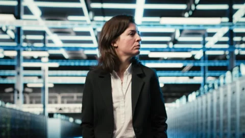 Data center manager inspecting IT infrastructure with blue wireframe mesh Video stock 329322282