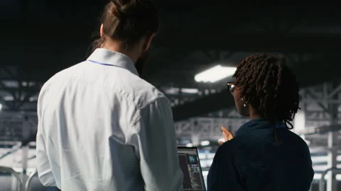 Data center manager overseeing work done by admin using AI LLM visualization Stock Footage 310782336