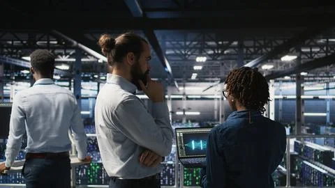 Data center manager overseeing work done by admin using AI LLM visualization Stock Photos