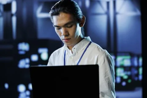 Data center manager runs code 写真素材