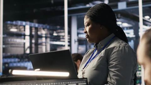 Data center manager supervising engineer tasked with analyzing neural networks Stock Photos