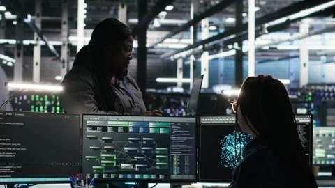 Data center manager supervising technician using node tree software Stock Footage 307031214