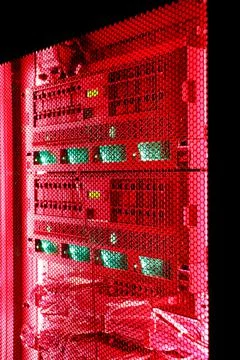 Data Center With Multiple Rows of Fully Operational Server Racks in server room Stock Photos