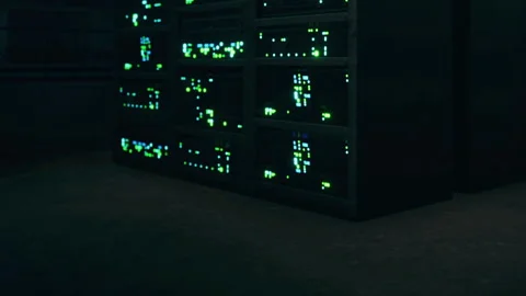 Data center at night with glowing server racks and dark surroundings Stock Footage 345006047