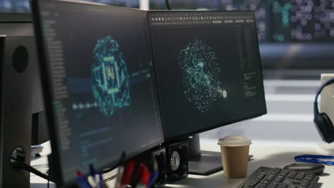Data center PCs showing neural network visualization and code debugging tools Stock Footage 309617744
