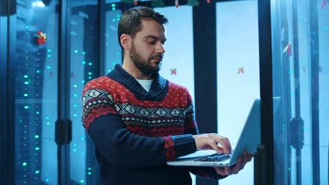 Data center professional working on laptop deactivating rack server room. Joyful Stock Footage 121121551